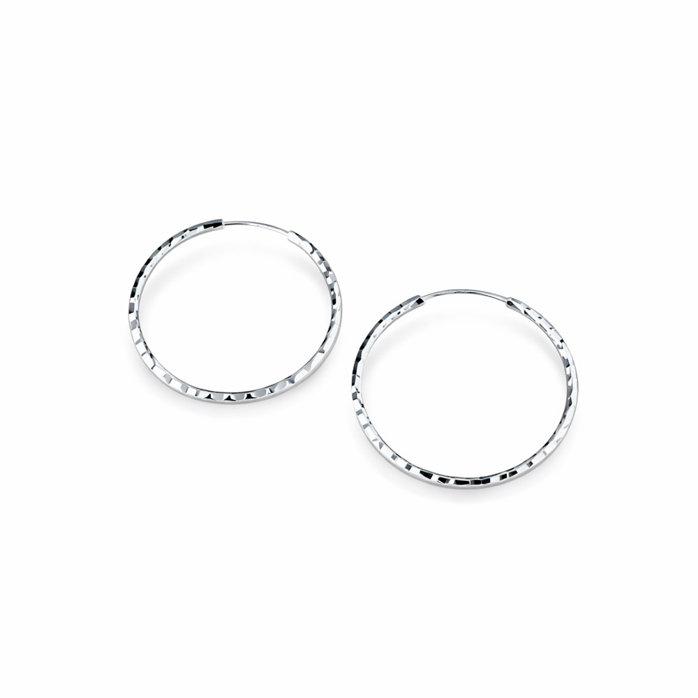 Orecchini a cerchio in oro bianco martellato diametro 25 mm